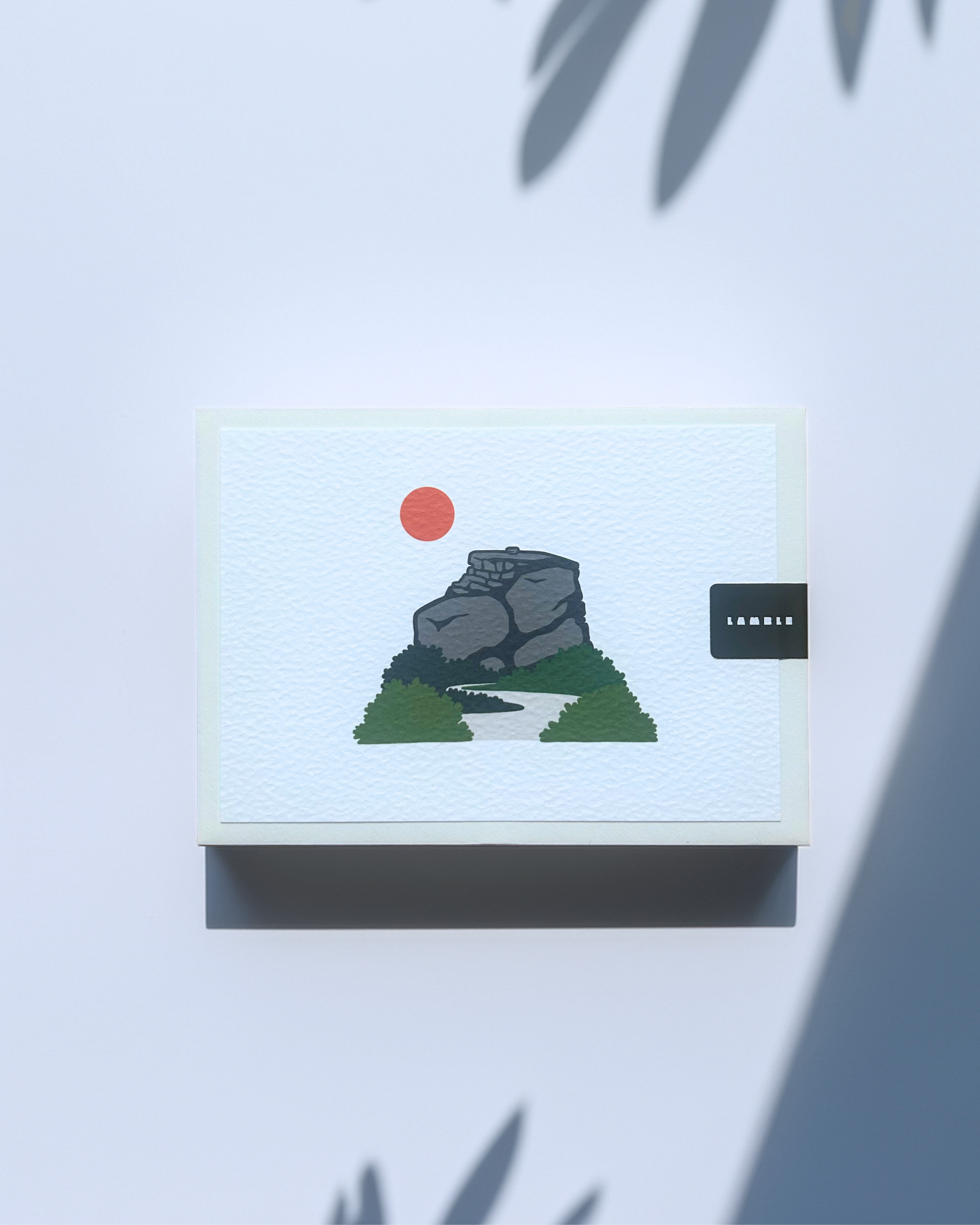 Peak District Art Print featuring a gritstone rock formation and a sun, printed on textured card.