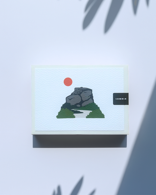 Peak District Art Print featuring a gritstone rock formation and a sun, printed on textured card.