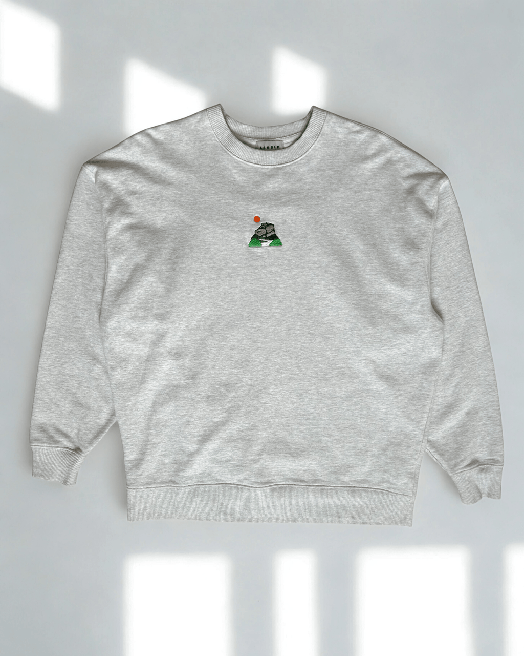 Peak District sweatshirt with embroidered gritstone edges design shown in a flat lay