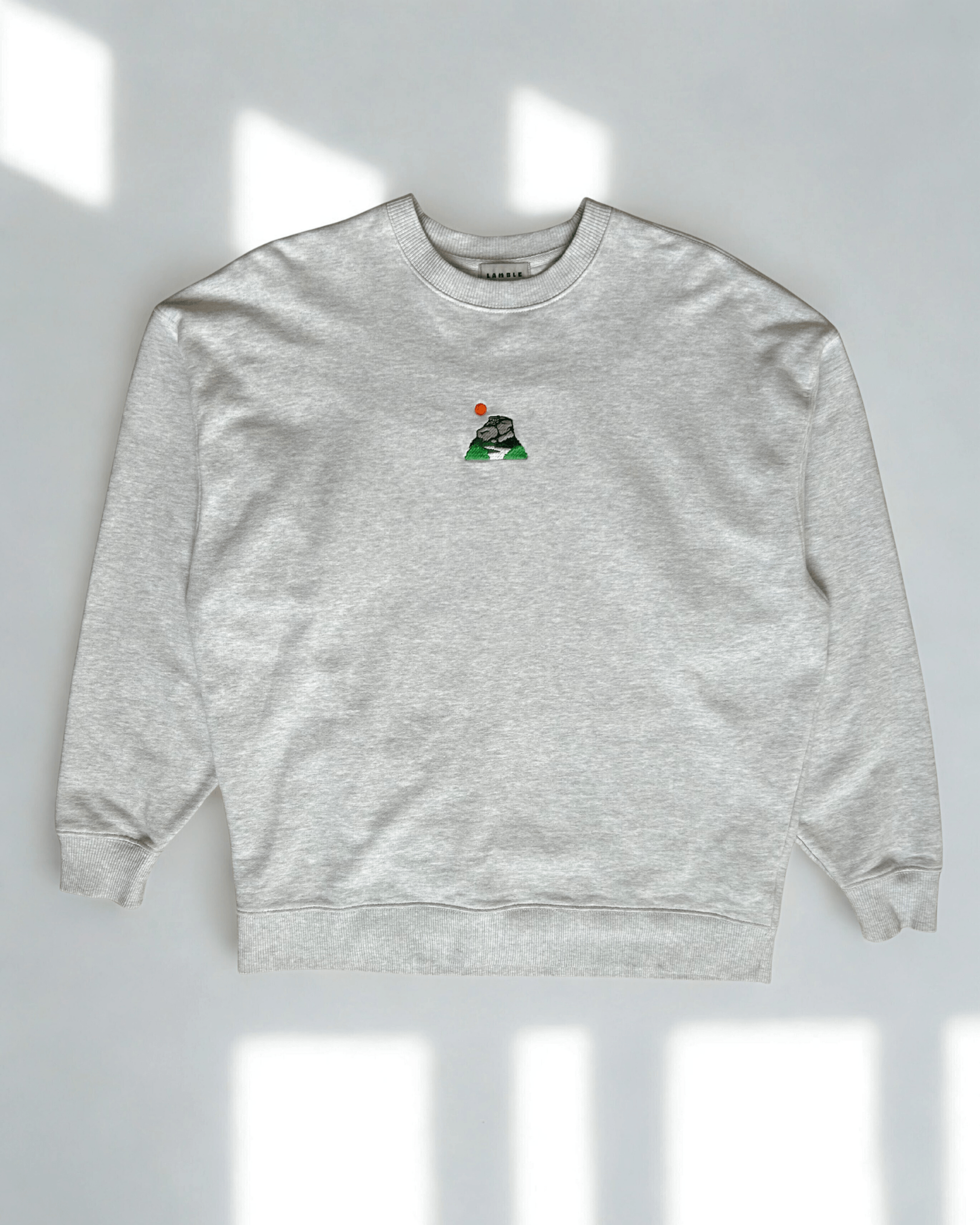 Peak District sweatshirt with embroidered gritstone edges design shown in a flat lay