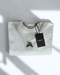 Peak District Sweatshirt folded with embroidered artwork of gritstone edges and hanging tag